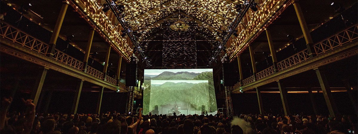 Holographic see-through front projection screen for festival